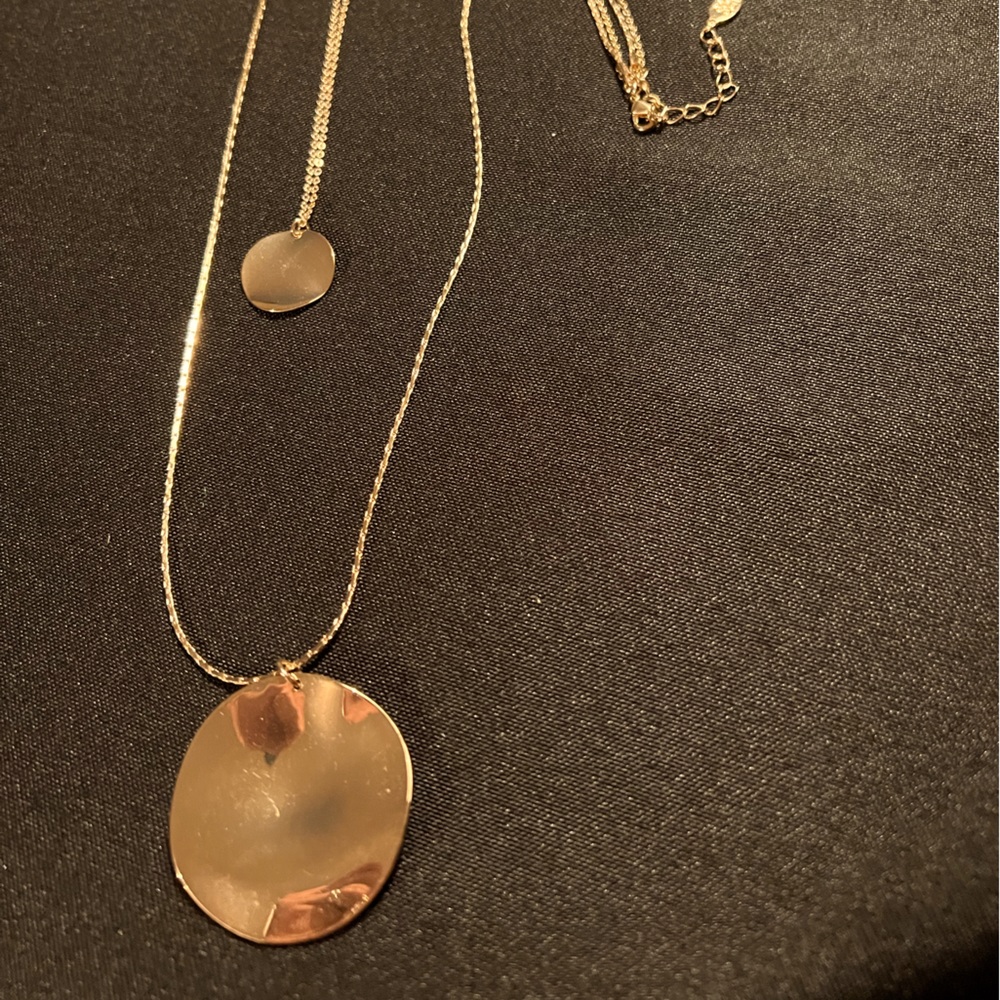 Double strand gold colored necklace with circular pendants. Short & long strands
